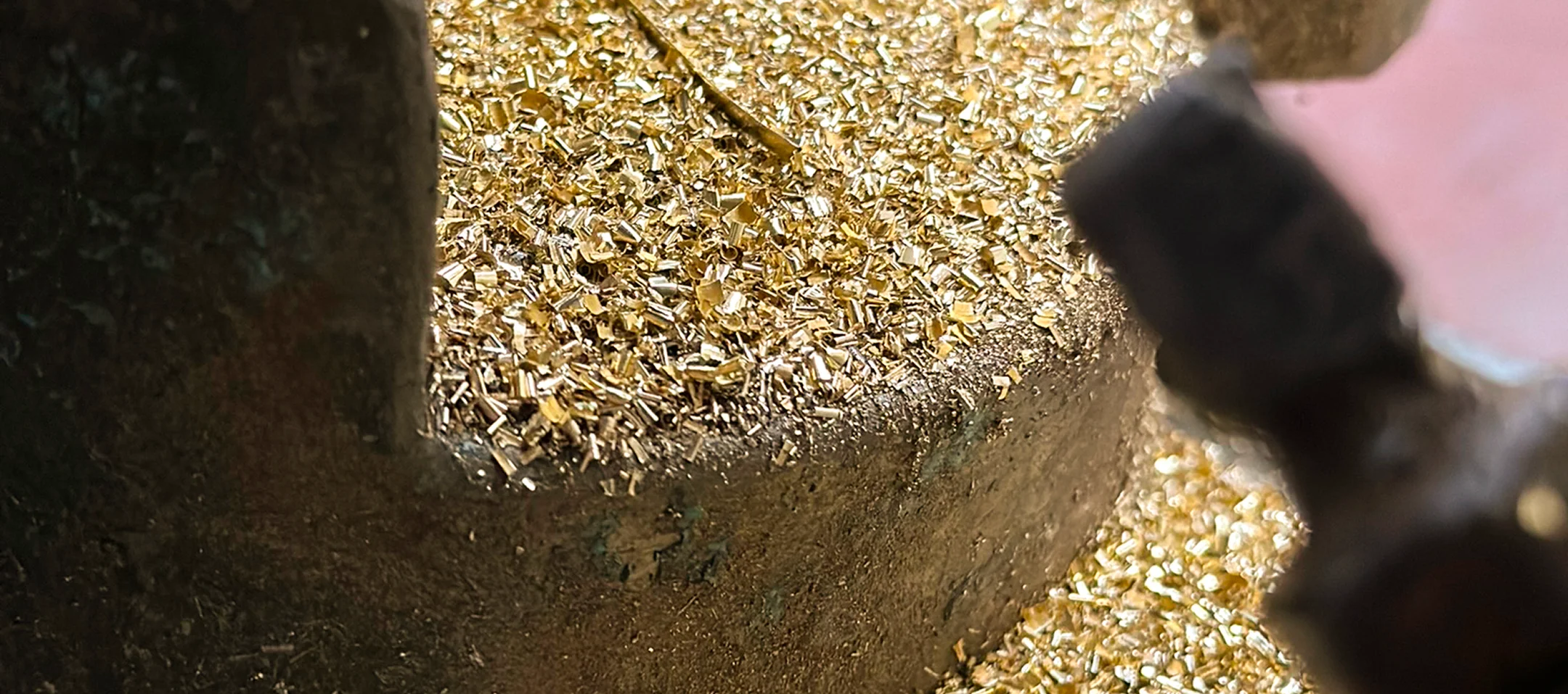 Olivia Ceiling Lamp with cylindrical brass suspension, oval design, and two opal white bulbs providing adjustable, sophisticated lighting for elegant living rooms.