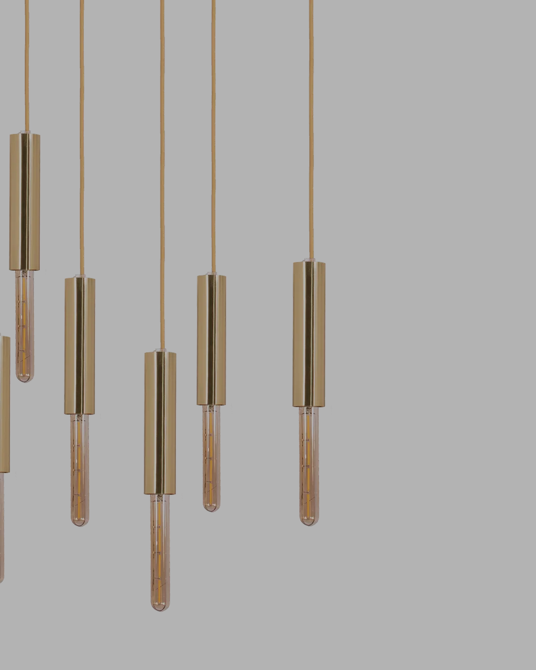 Lightrain Ceiling Lamp with sculptural brass structure, suspended cylinders, and elegant filament bulbs, creating a warm and artistic illumination for luxury interiors.