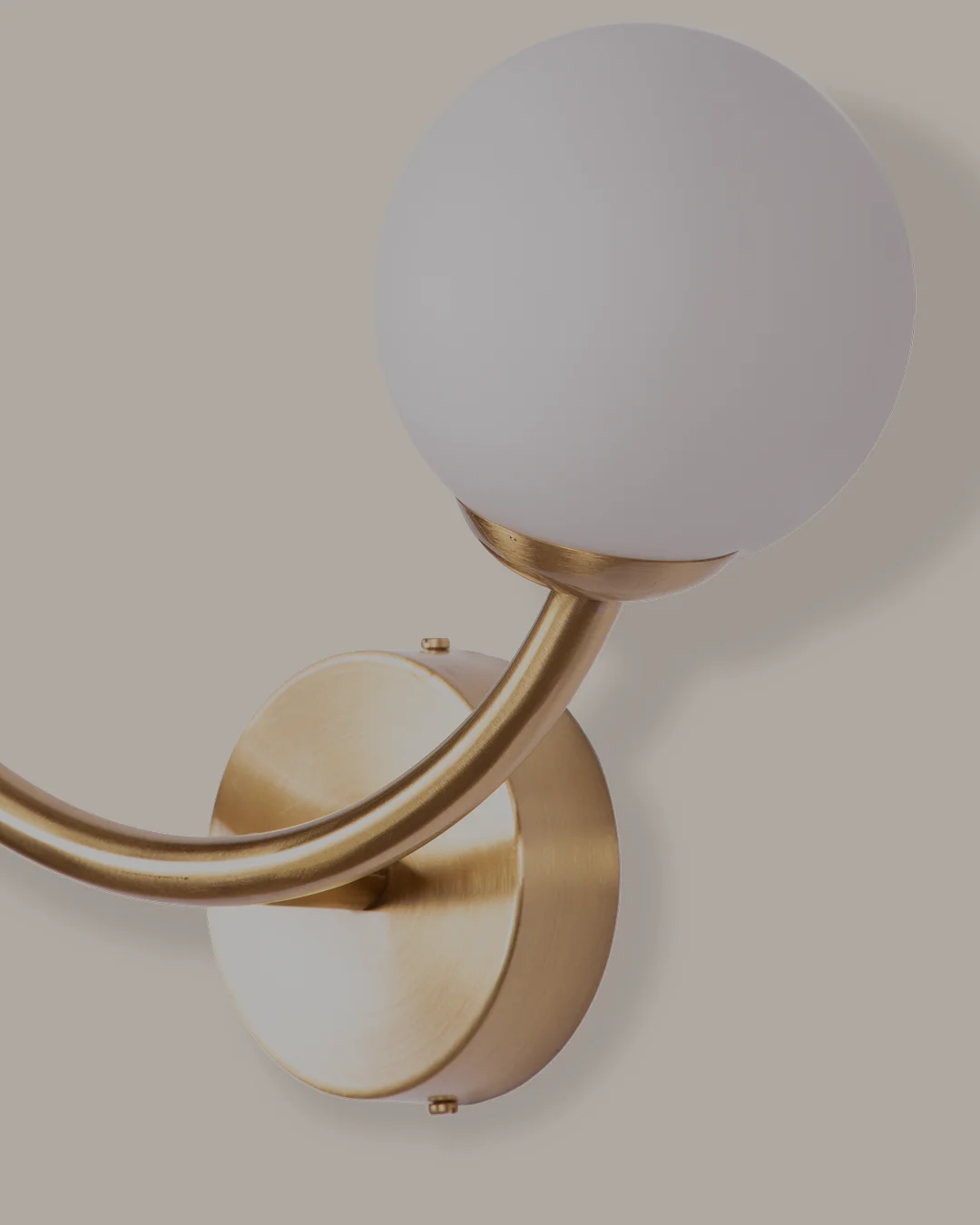 Gabriela Wall Lamp with crescent-shaped brass design and two opal white cylindrical bulbs, elegant lighting for luxury interiors.