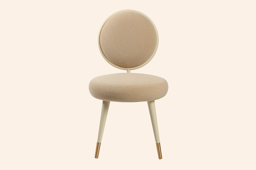 Graceful Chair with rounded upholstered seat and backrest, brass cylinder detail, and lacquered or upholstered legs for luxury interior design