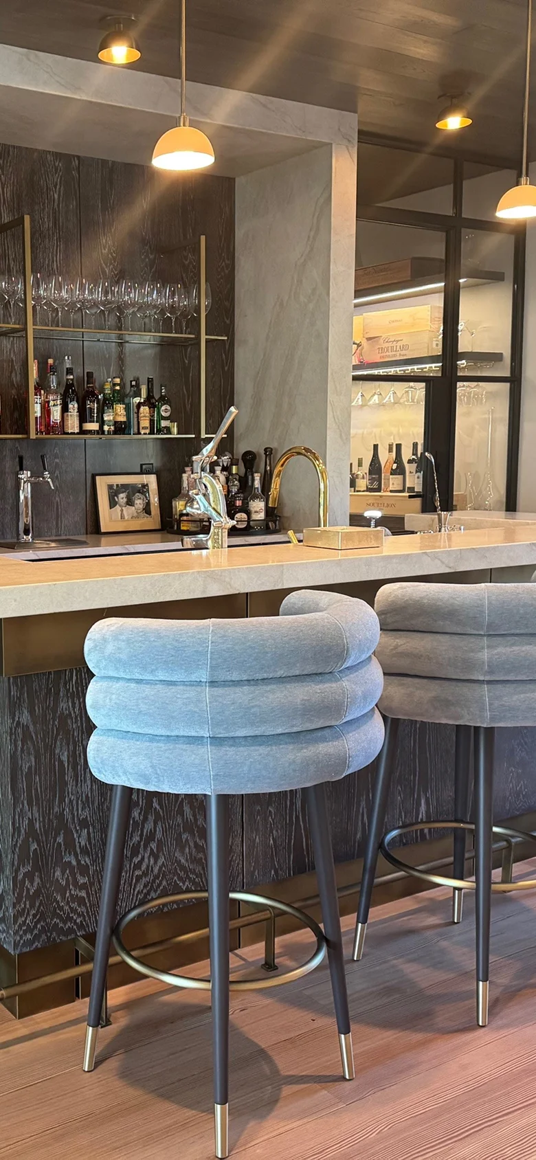 Marshmallow Bar/Counter Stool with three fully upholstered cylindrical rolls, brass cylinder footrest, lacquered or upholstered legs with brass bases, sculptural geometry, tactile comfort, and luxury materials for modern interiors