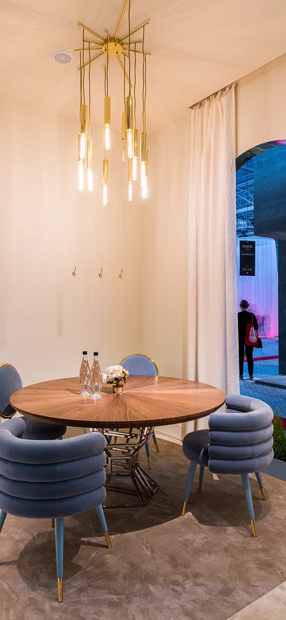 Lightrain Ceiling Lamp with sculptural brass structure, suspended cylinders, and elegant filament bulbs, creating a warm and artistic illumination for luxury interiors.