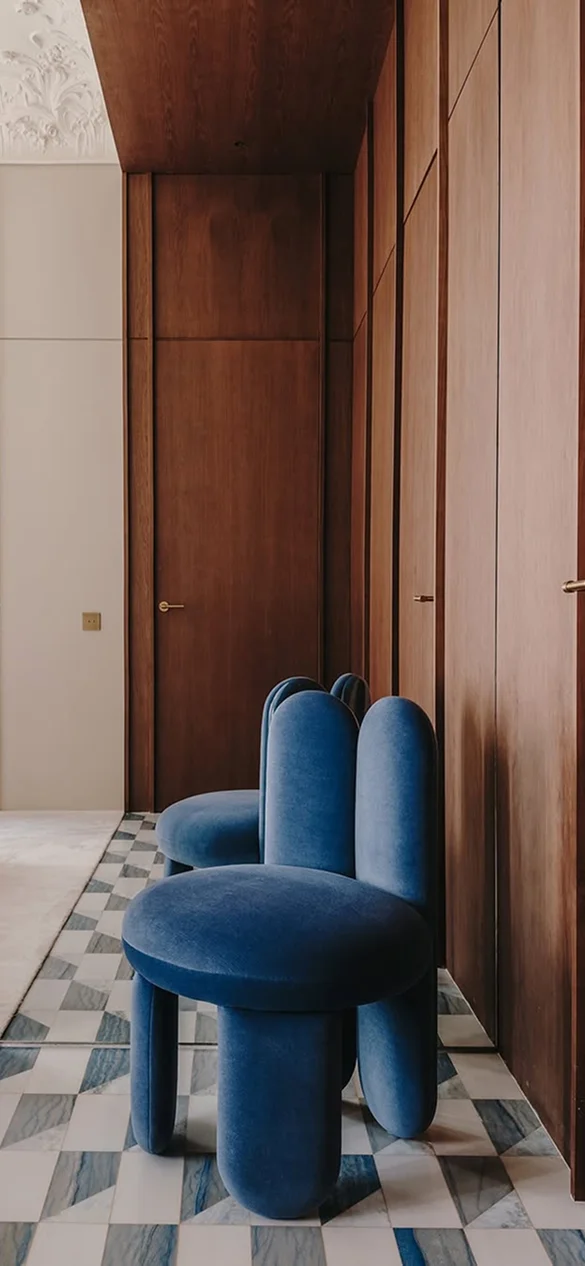 Glazy Chair with fully upholstered seat, legs, and inner backrest, lacquered outer backrest with sculptural “ear” design extending to the floor, bold form and luxury materials for high-end interior design