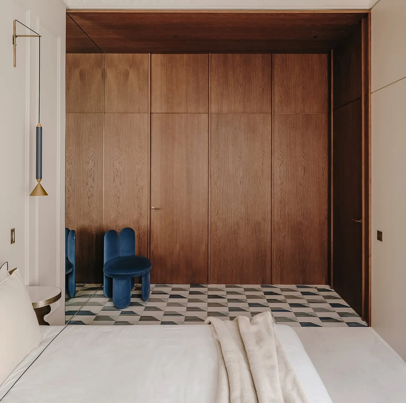 Glazy Chair with fully upholstered seat, legs, and inner backrest, lacquered outer backrest with sculptural “ear” design extending to the floor, bold form and luxury materials for high-end interior design