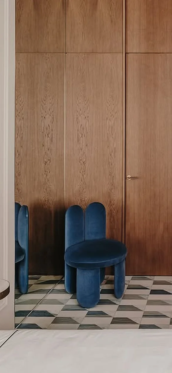 Glazy Chair with fully upholstered seat, legs, and inner backrest, lacquered outer backrest with sculptural “ear” design extending to the floor, bold form and luxury materials for high-end interior design