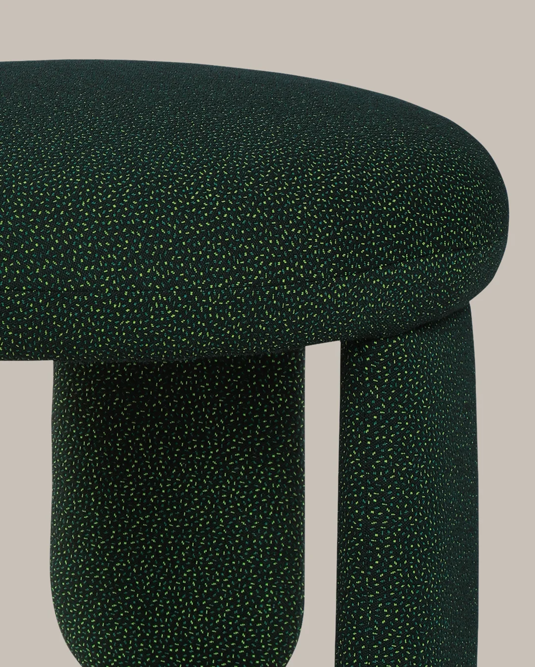 Glazy Stool with fully upholstered round seat, three legs, two upholstered and one lacquered in high gloss, wide base, sculptural designer stool with elegant curves for modern interiors.