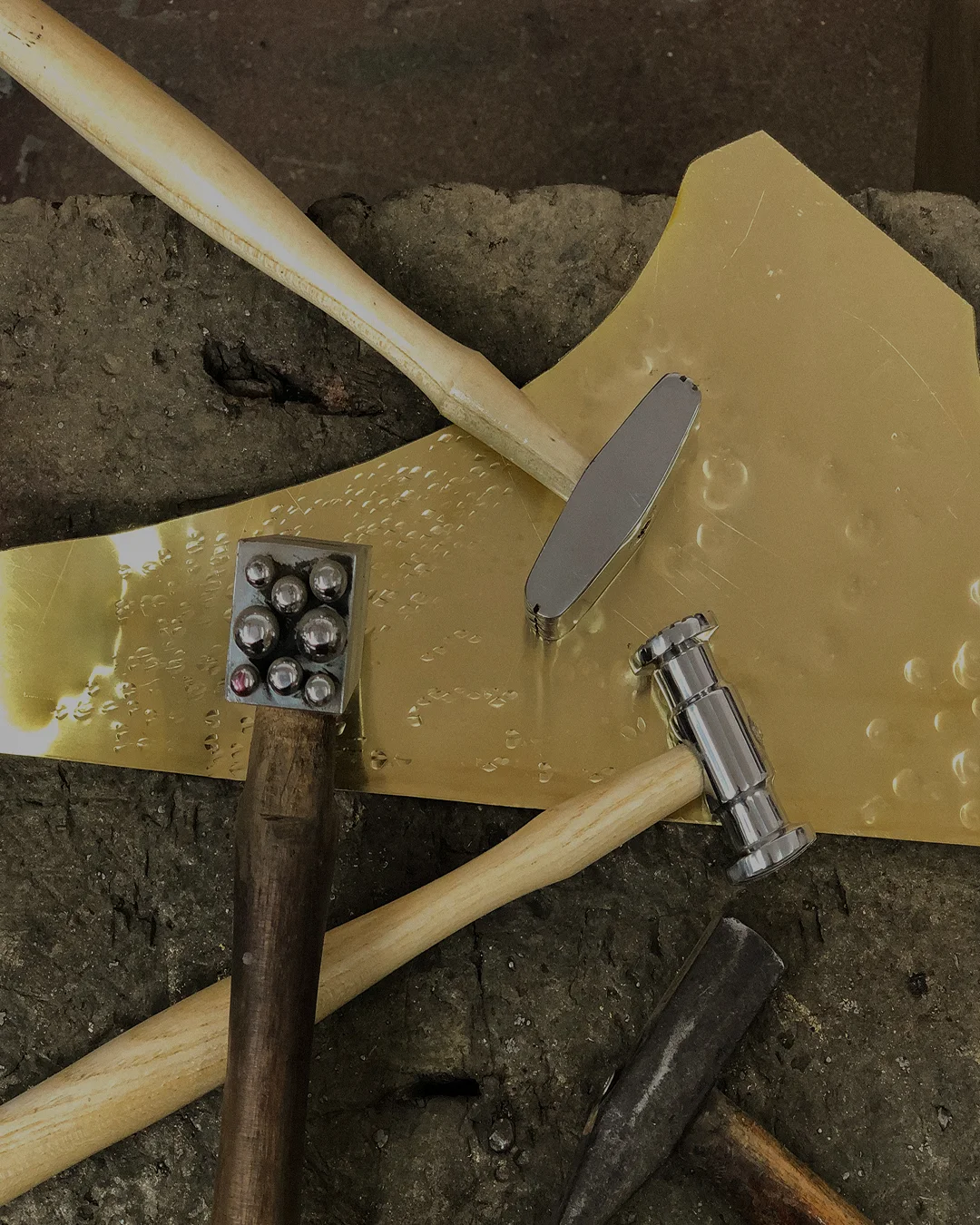 Laura Wall Lamp with crescent-shaped brass design and two upward-facing opal white cylindrical bulbs, elegant lighting for luxury interiors.