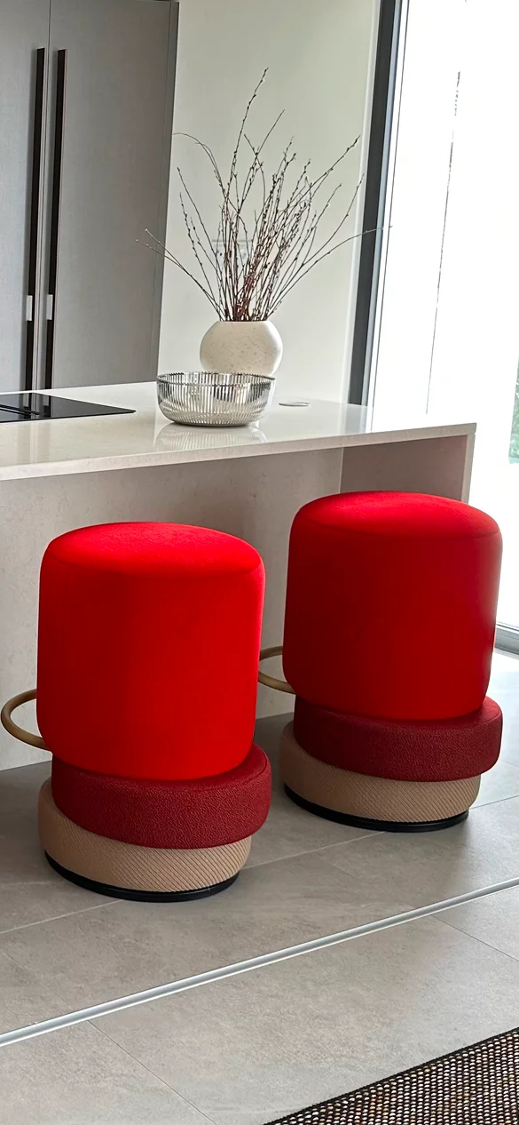 Luxury Lipstick Bar Counter Stool with three upholstered sculptural tiers, brass ring accent, and cylindrical silhouette, ideal for modern interior design and stylish living spaces