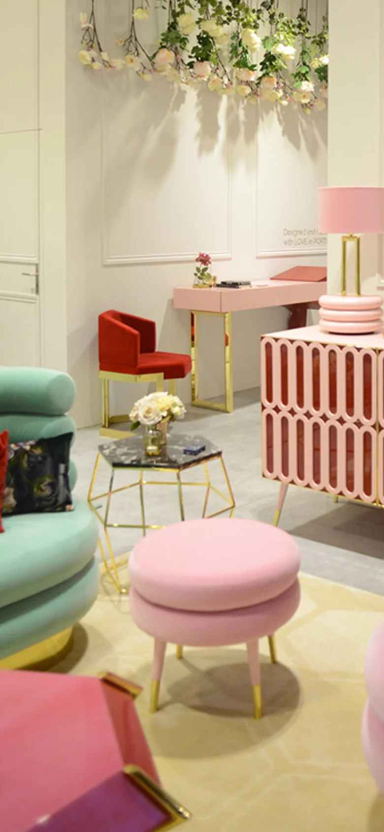 Low Marshmallow Stool with two fully upholstered cylindrical rolls, brass ring accent, and playful sculptural design for modern interiors and luxury living spaces.