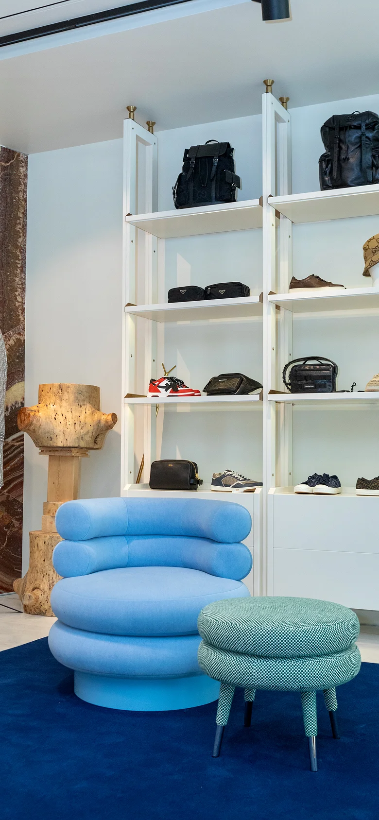 Low Marshmallow Stool with two fully upholstered cylindrical rolls, brass ring accent, and playful sculptural design for modern interiors and luxury living spaces.