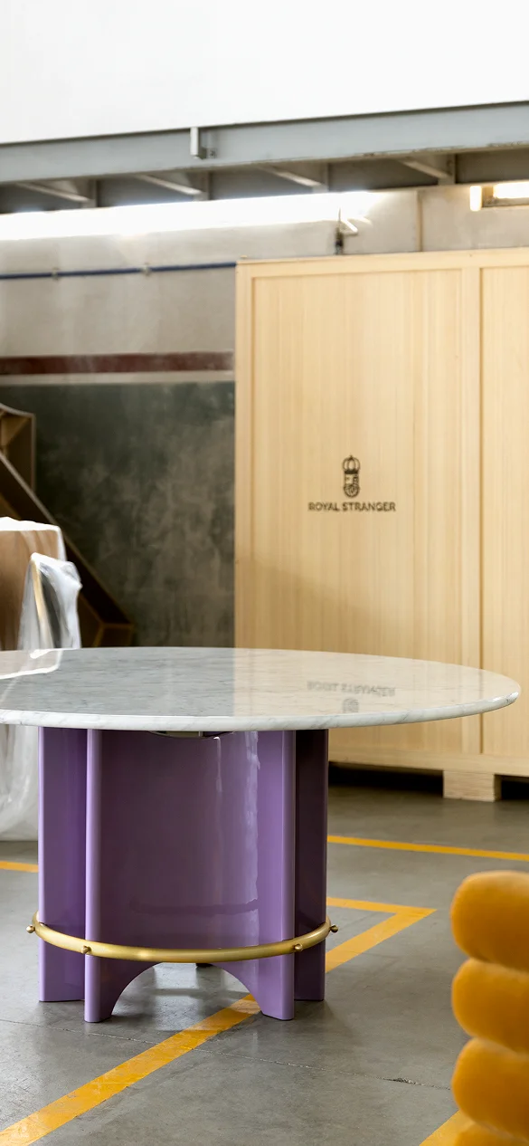 Meyer Dining Table with circular marble top, sculptural lacquered base, brass ring, and exposed screws, handcrafted designer furniture for modern luxury interiors