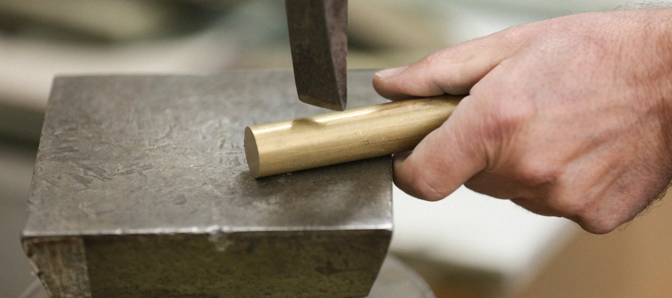 Meyer Dining Table with circular marble top, sculptural lacquered base, brass ring, and exposed screws, handcrafted designer furniture for modern luxury interiors