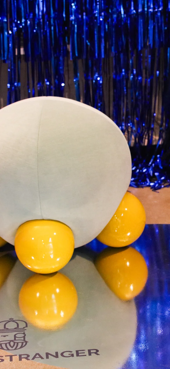 Royal Stranger Naboo stool, sculptural high-end design with plush upholstery and three bold lacquered spherical legs.