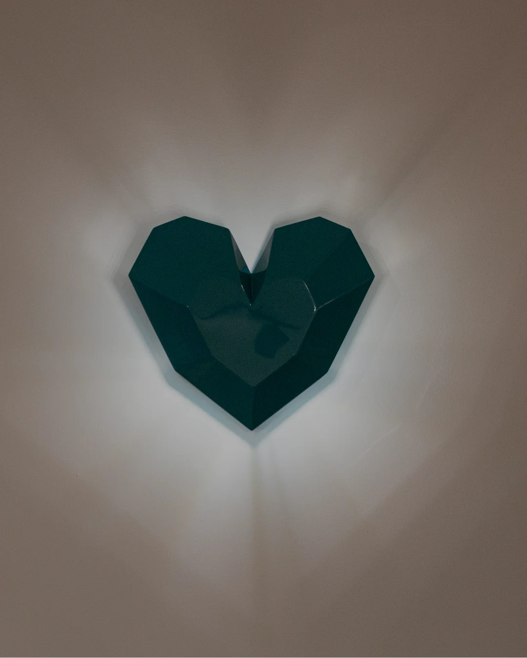 Queen Heart Wall Lamp with three-dimensional heart-shaped design casting soft, warm light for whimsical and stylish interiors.