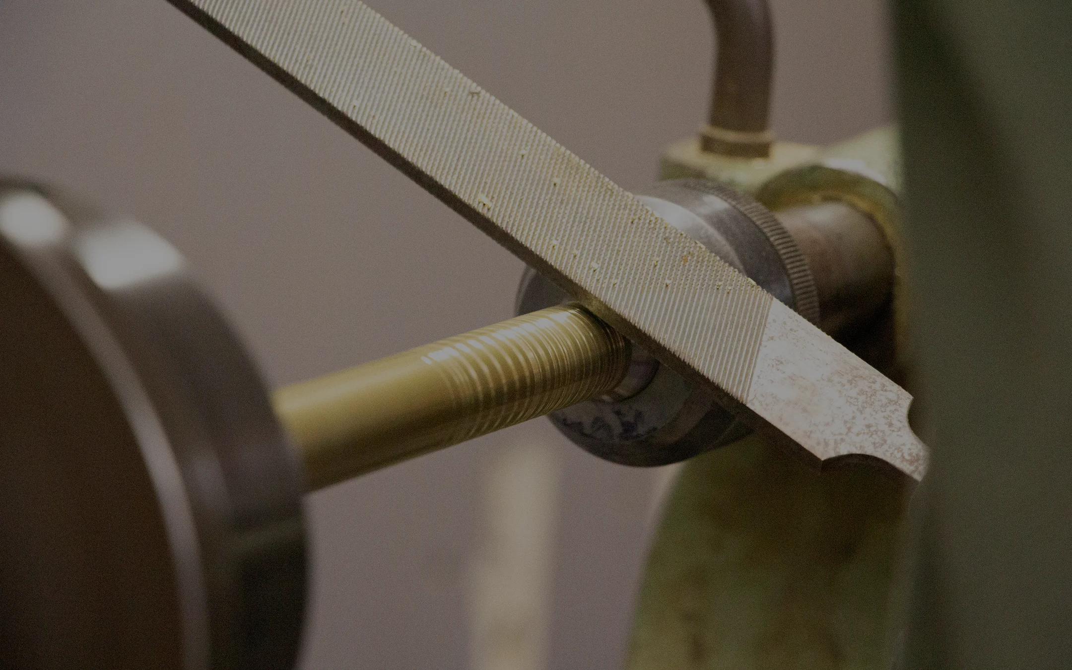 Architectural lighting from the MAAM collection by Royal Stranger, featuring the Valentina floor lamp with its brushed brass structure and hand-applied striped porcelain.