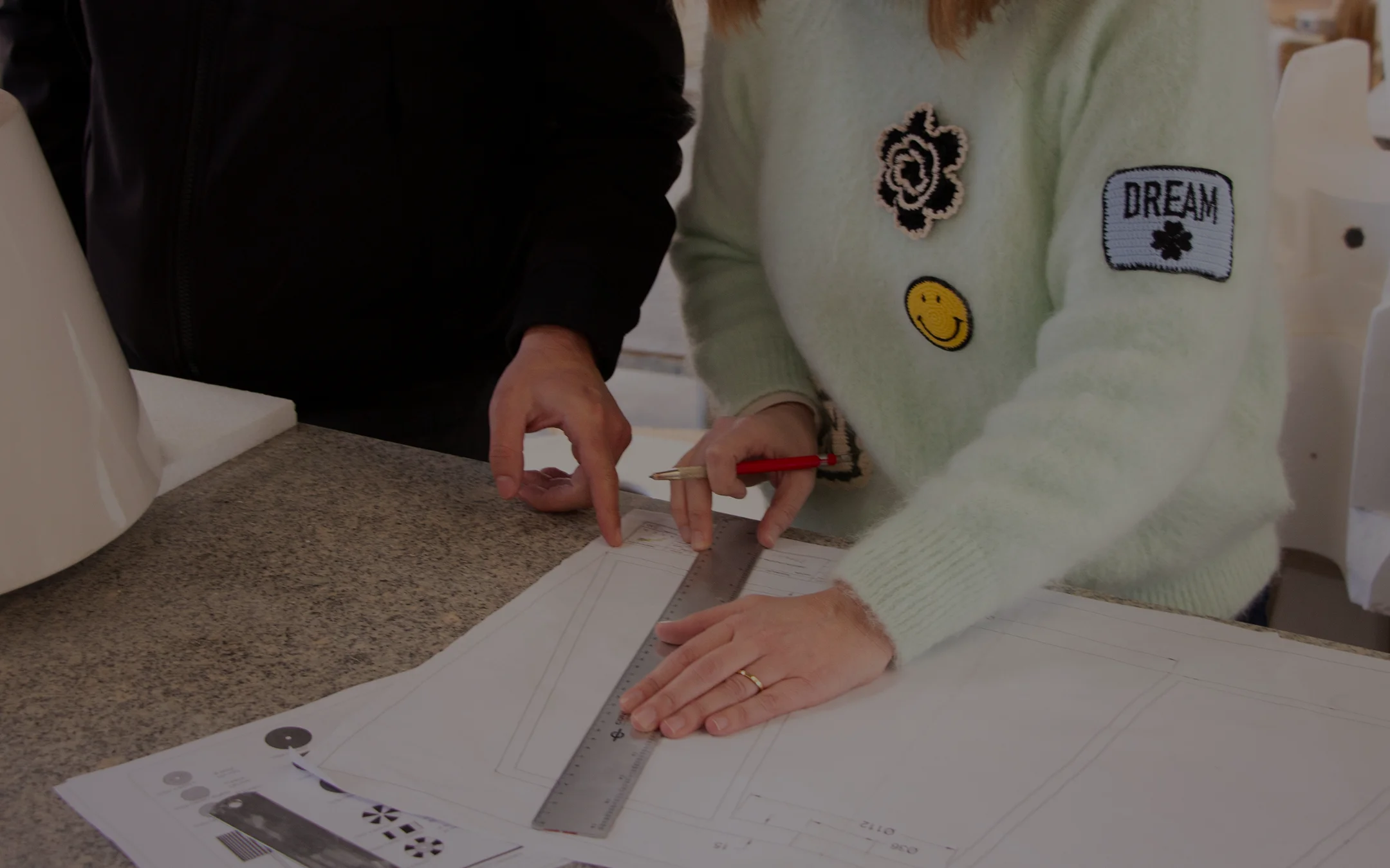 Architectural lighting from the MAAM collection by Royal Stranger, featuring the Valentina floor lamp with its brushed brass structure and hand-applied striped porcelain.